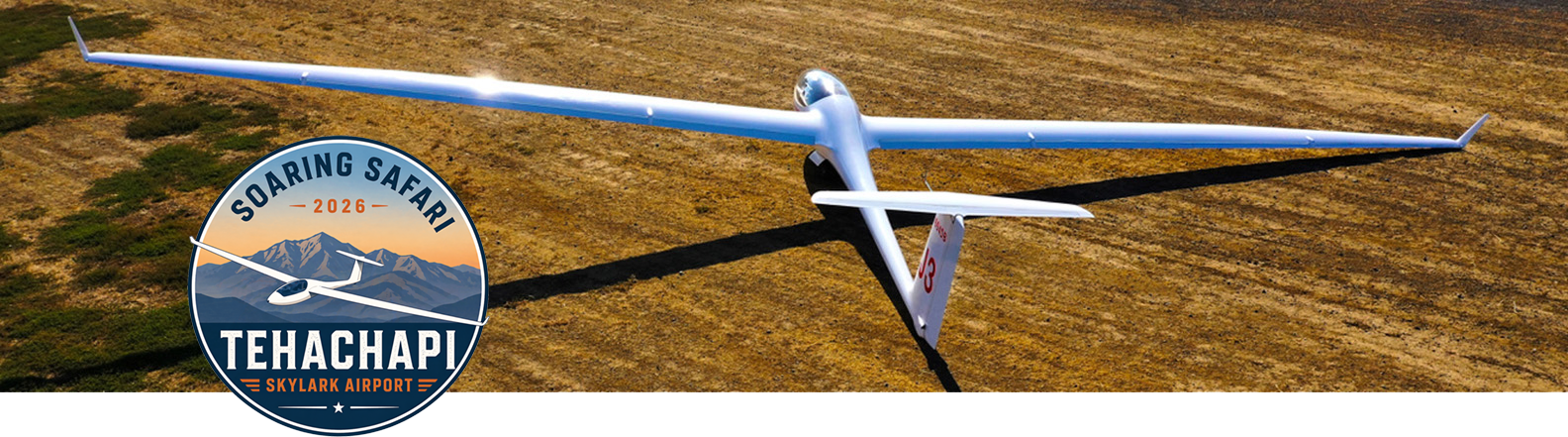 Glider on the ground at Tehachapi with Soaring Safari badge